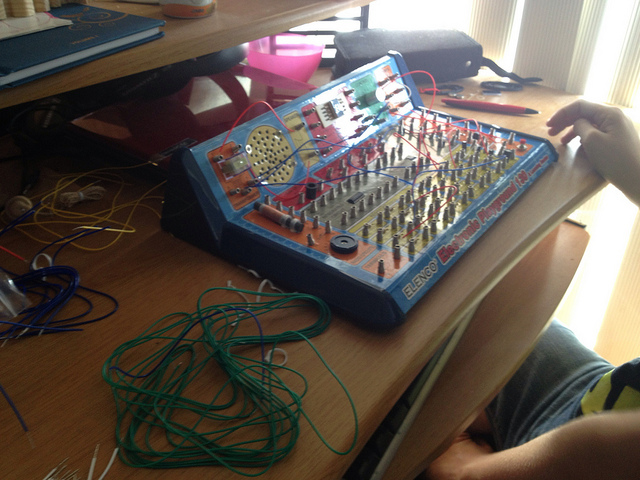 messy desk with circuitry board